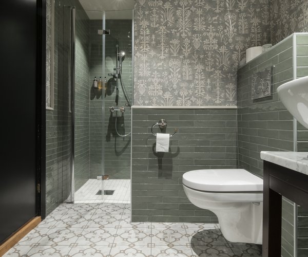 Shower in the bathroom of the deluxe room with sloped ceiling
