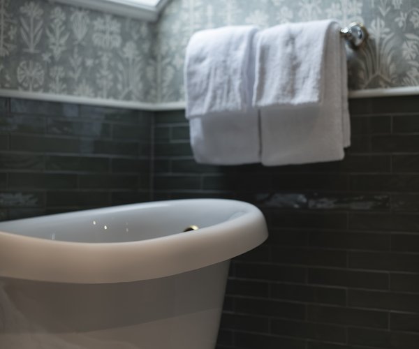 Free-standing bath beneath the skylight in the junior suite